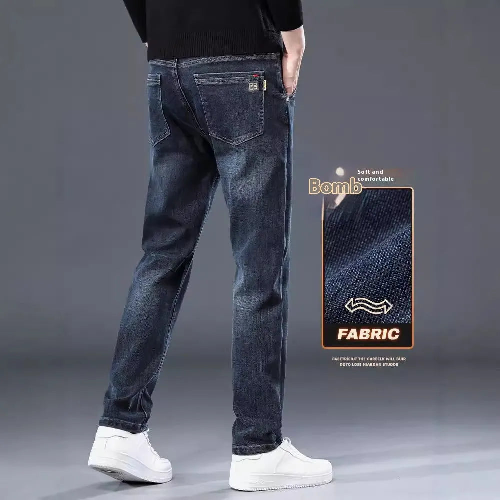 Man wearing slim straight blue grey casual trousers with a zip fly and mid waist.