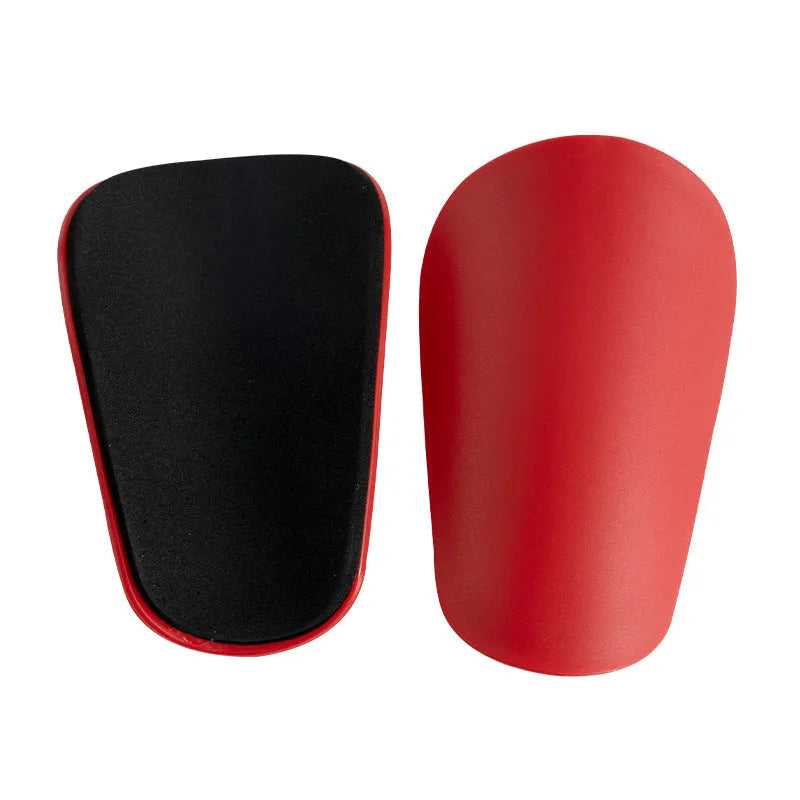 PU mini shin guards in various colours on a leg, showing S and XS sizing for sports protection.