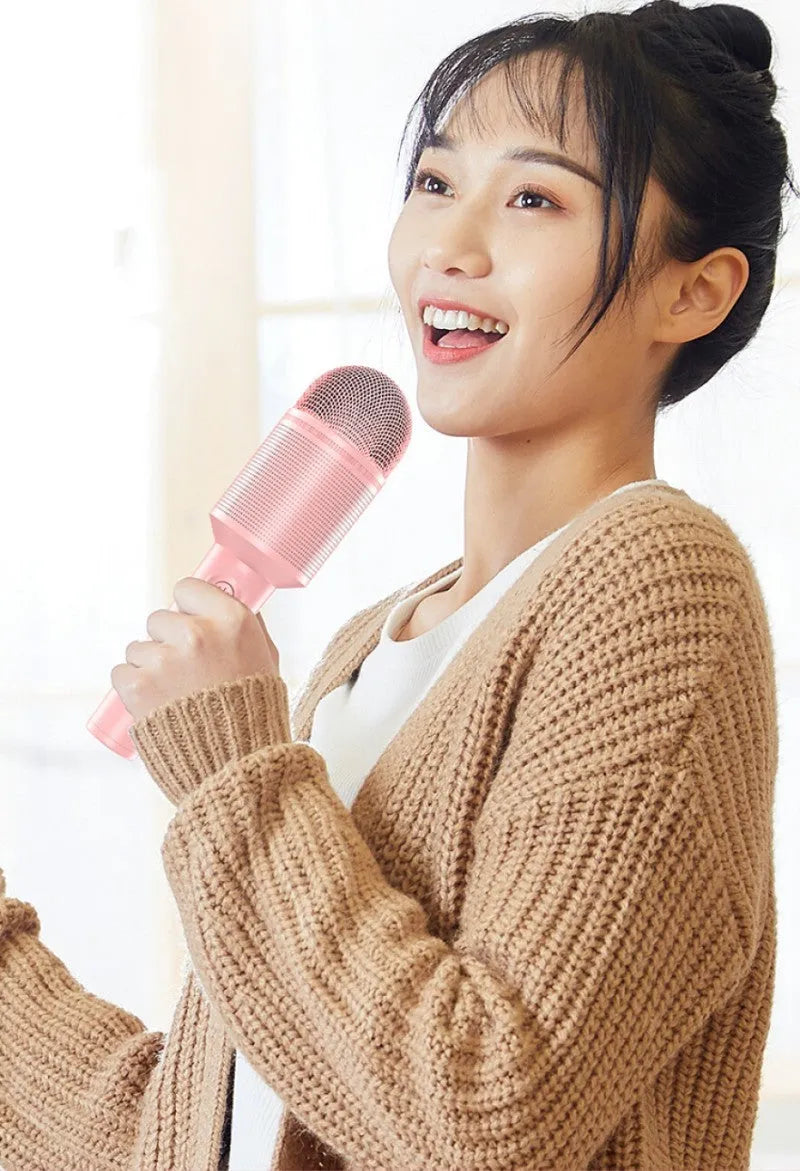 Pink, blue, and green wireless Bluetooth karaoke microphone with USB connection