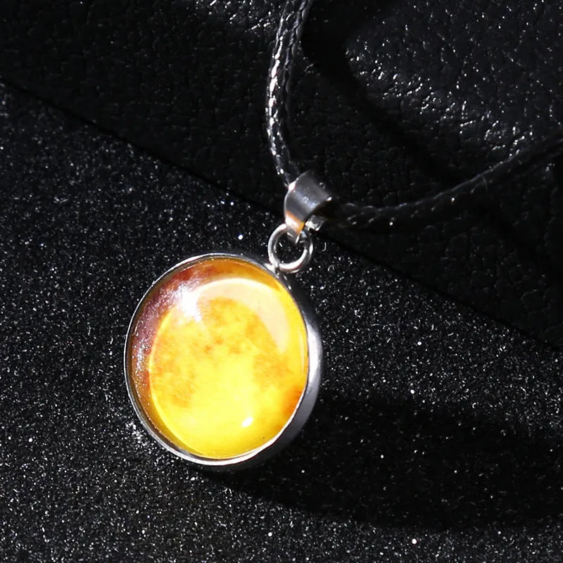 Christmas moon and night sky luminous constellation pendant on a glass necklace chain.
