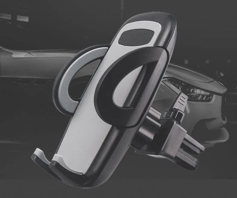Black plastic car air vent mobile phone holder mounted on a car vent, holding a smartphone.