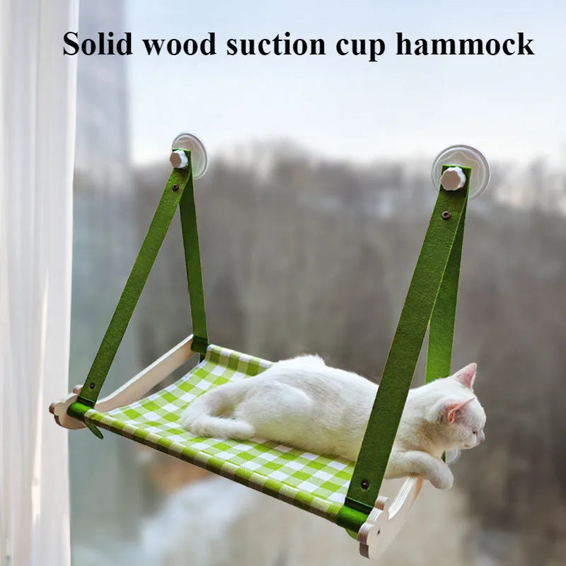 Wooden frame cat window hammock bed with linen fabric attached by suction cups to a window.