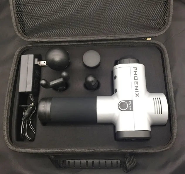 Black fascia massage gun with four removable heads on a grey background