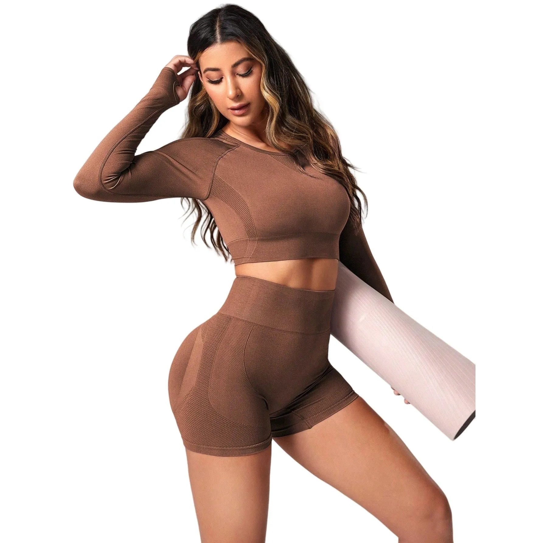 Women's black yoga suit set showing long sleeve pullover top and high-waisted tight-fitting pants.