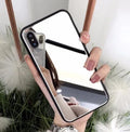 Black iPhone case with a reflective mirror surface on the back, compatible with iPhone X and iPhone 7/8 Plus models.