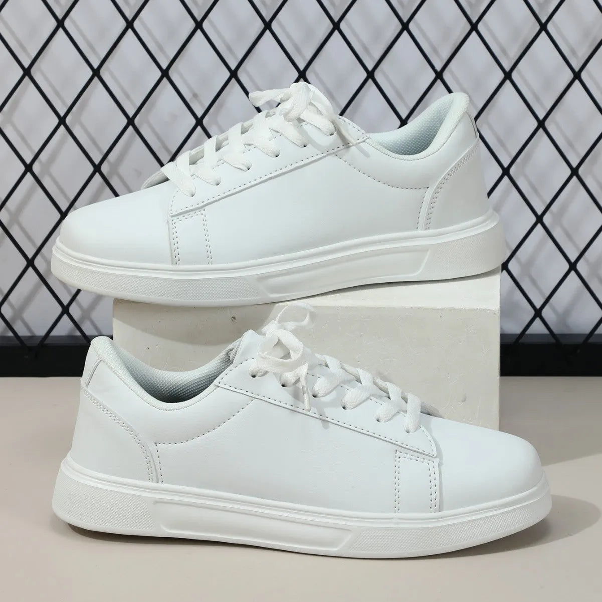 Casual platform sneaker with cross strap detail on artificial PU upper in beige brown colour