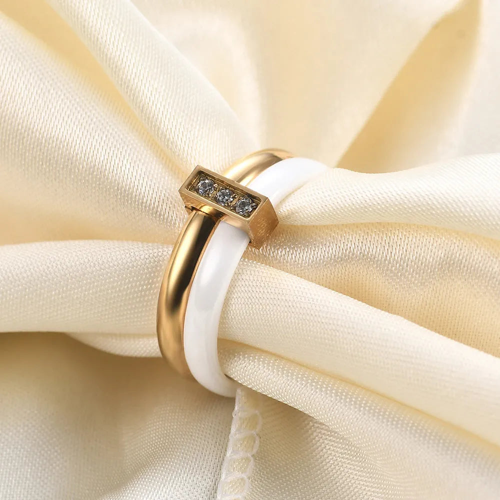 Ceramic geometric women's ring with glossy stitching and zirconium elements in steel black colour