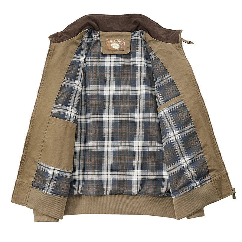 Men's beige washed cotton baseball style flight jacket on a hanger, showing classic design.