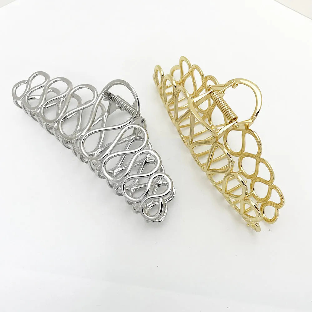 Large minimalist hair clip in gold or silver with tassel detail for updo styling