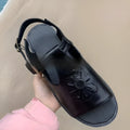 Men's black embroidered beach sandals with floral pattern and flat heel