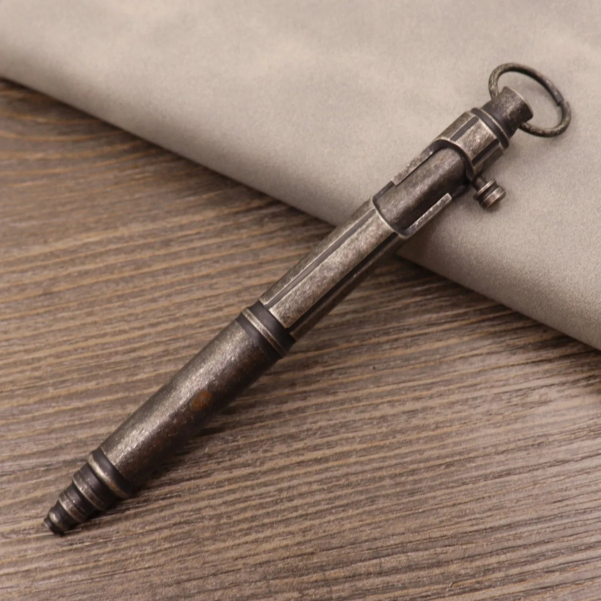 Retro brass tactical press pen with machine gun styling and solid brass construction