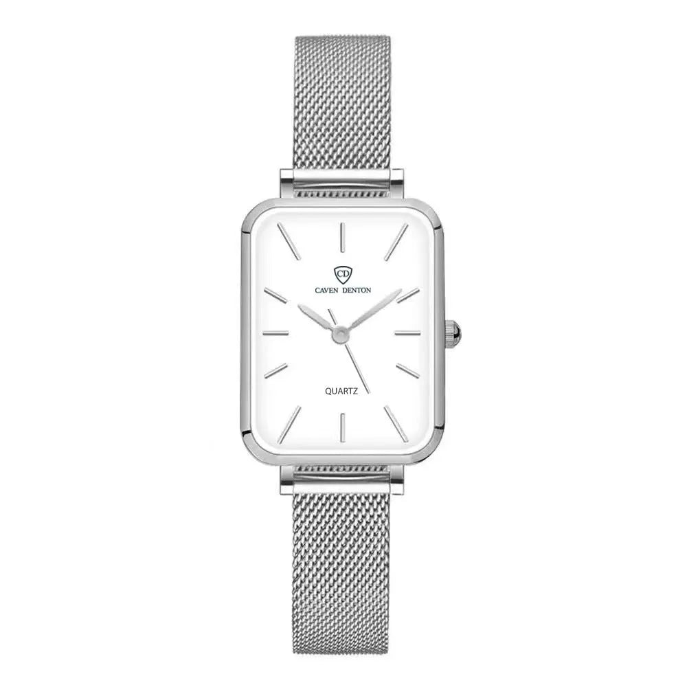 Rose gold women's waterproof quartz watch with woven steel strap on wrist.