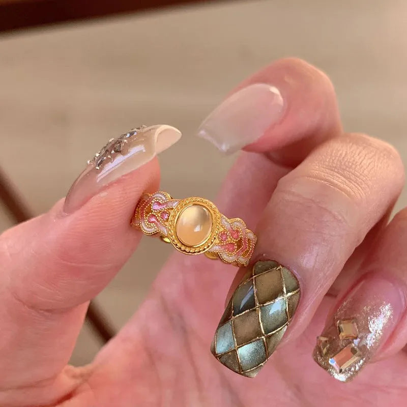 Women's pink crystal enamel adjustable ring with geometric open design on gold-plated copper