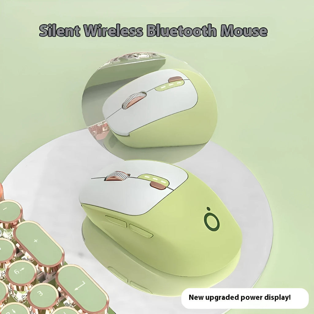 Mute wireless Bluetooth mouse in matcha green colour on a desk, showing ergonomic right-handed shape.