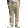 Man wearing loose fit high-waist straight leg casual trousers in Army Green.