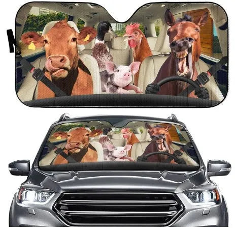 Telescopic aluminium foil car sun visor extended across a car front windscreen