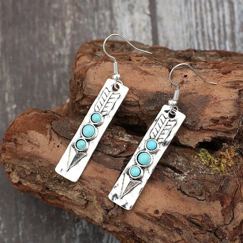 Long strip silver earrings with geometric shape and turquoise colour inlay