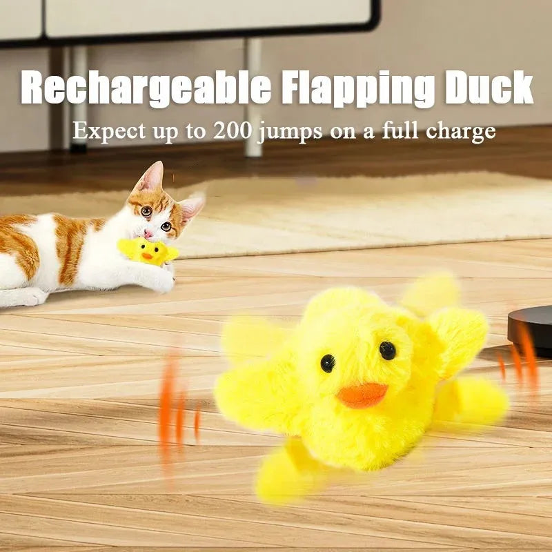 Yellow flapping duck cat plush toy with vibration sensor and USB charging cable on a neutral background.