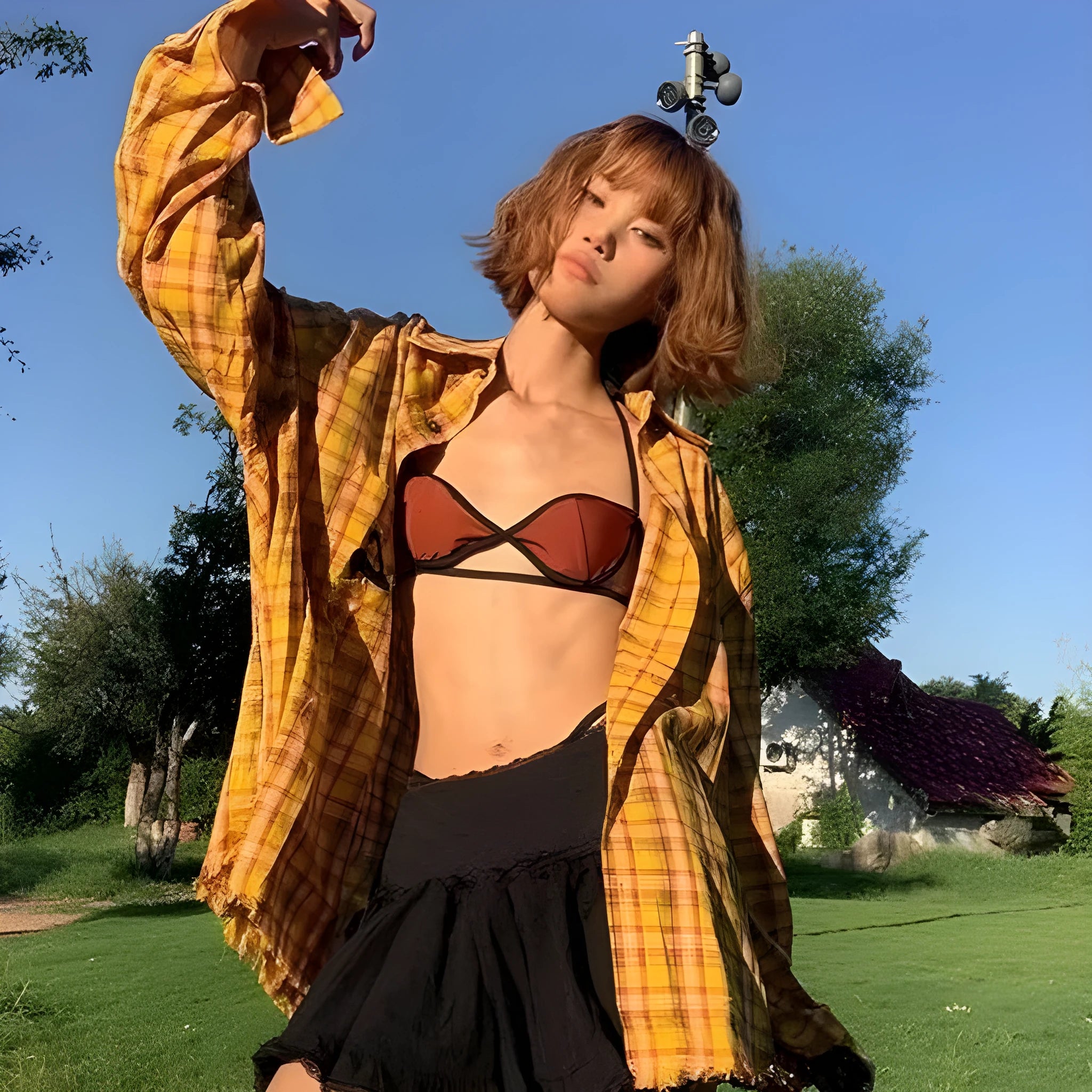 Loose-fitting dopamine yellow plaid cardigan-style shirt on a hanger