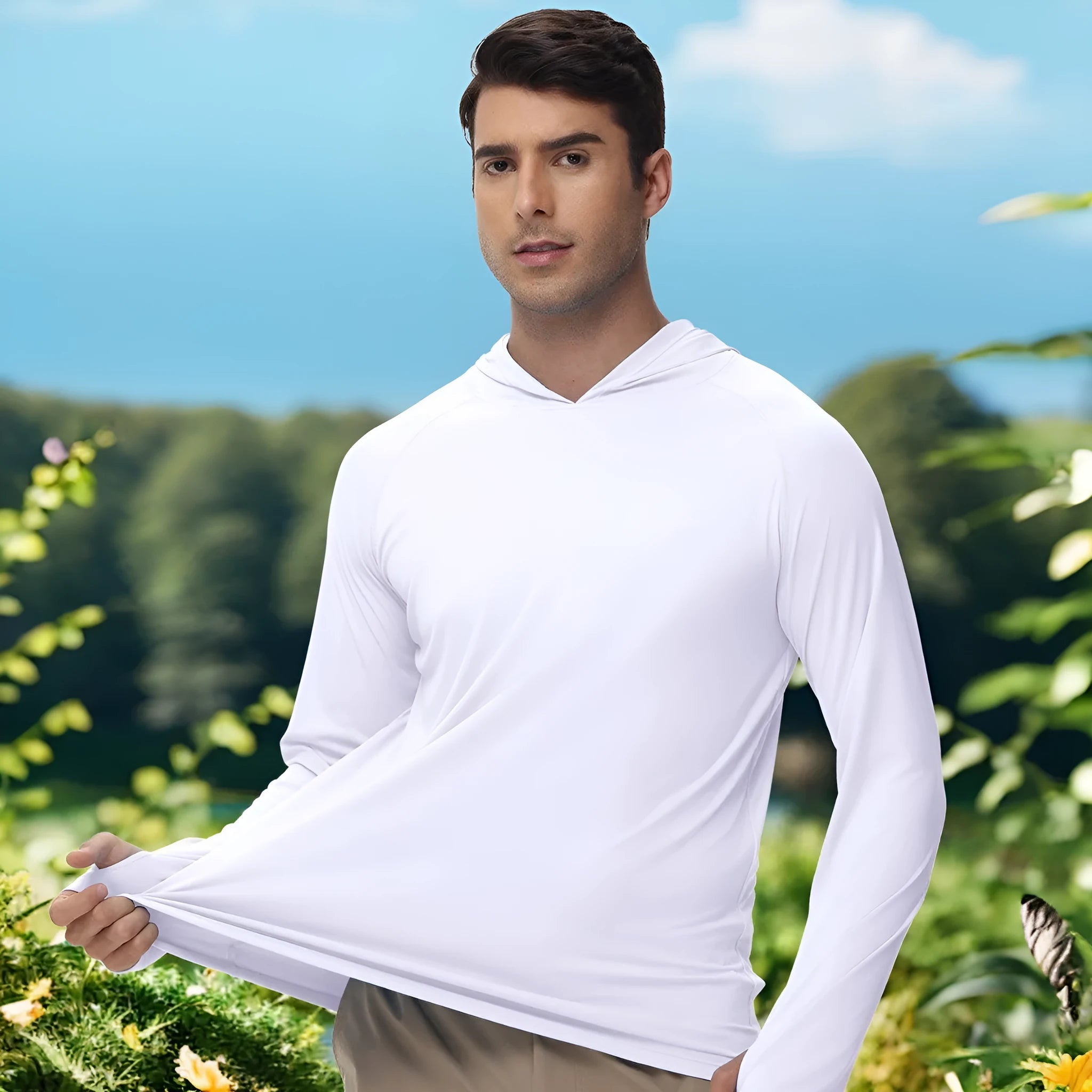 Man wearing a thin grey long sleeve hooded outdoor top for UV protection during fishing or hiking.