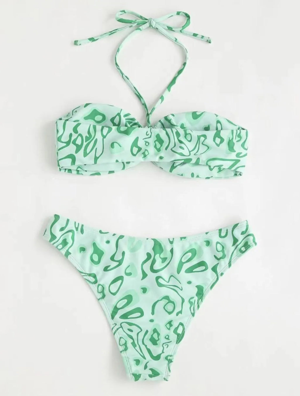 Green floral bandeau bikini with split design and backless styling on swimwear model