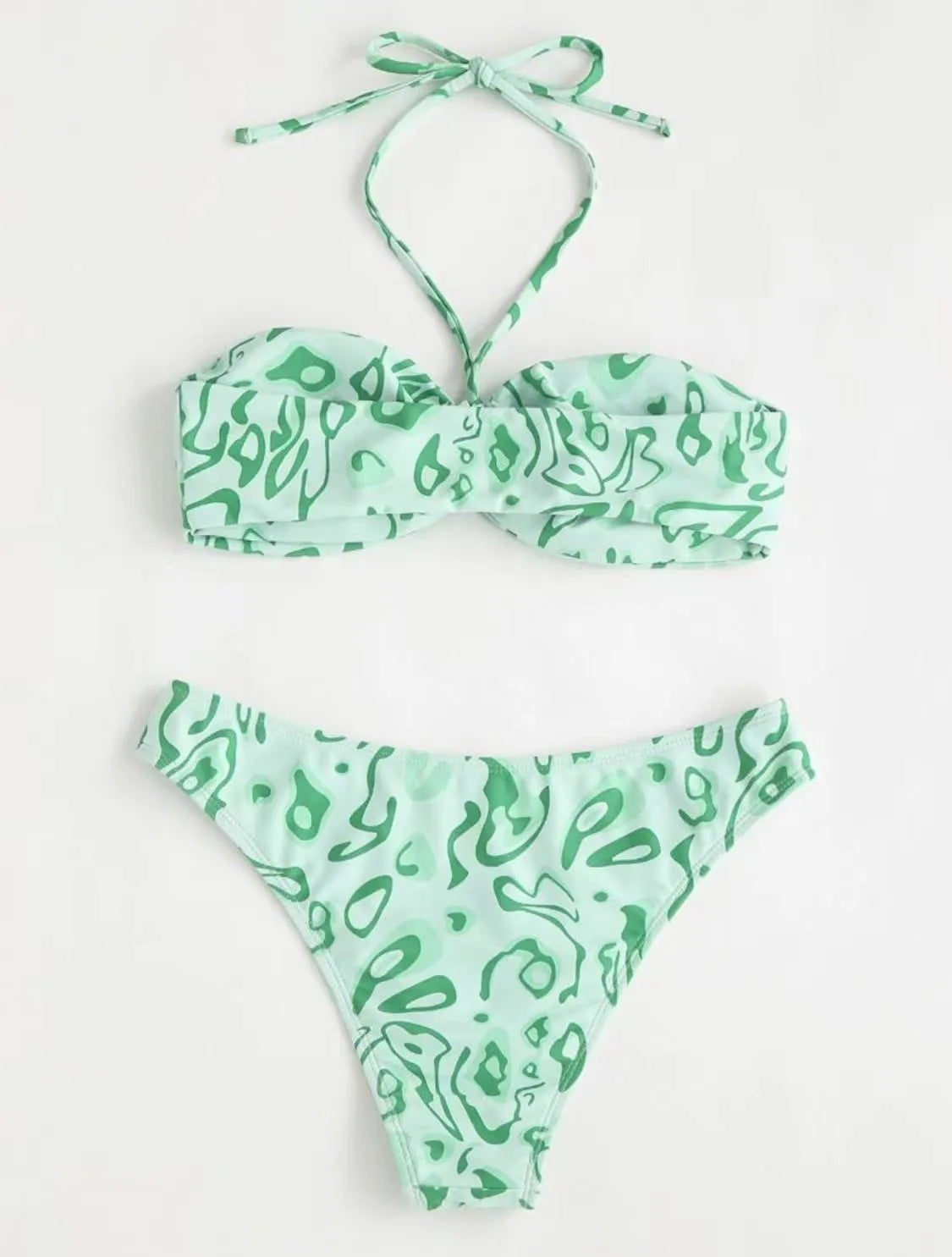 Green floral bandeau bikini with split design and backless styling on swimwear model