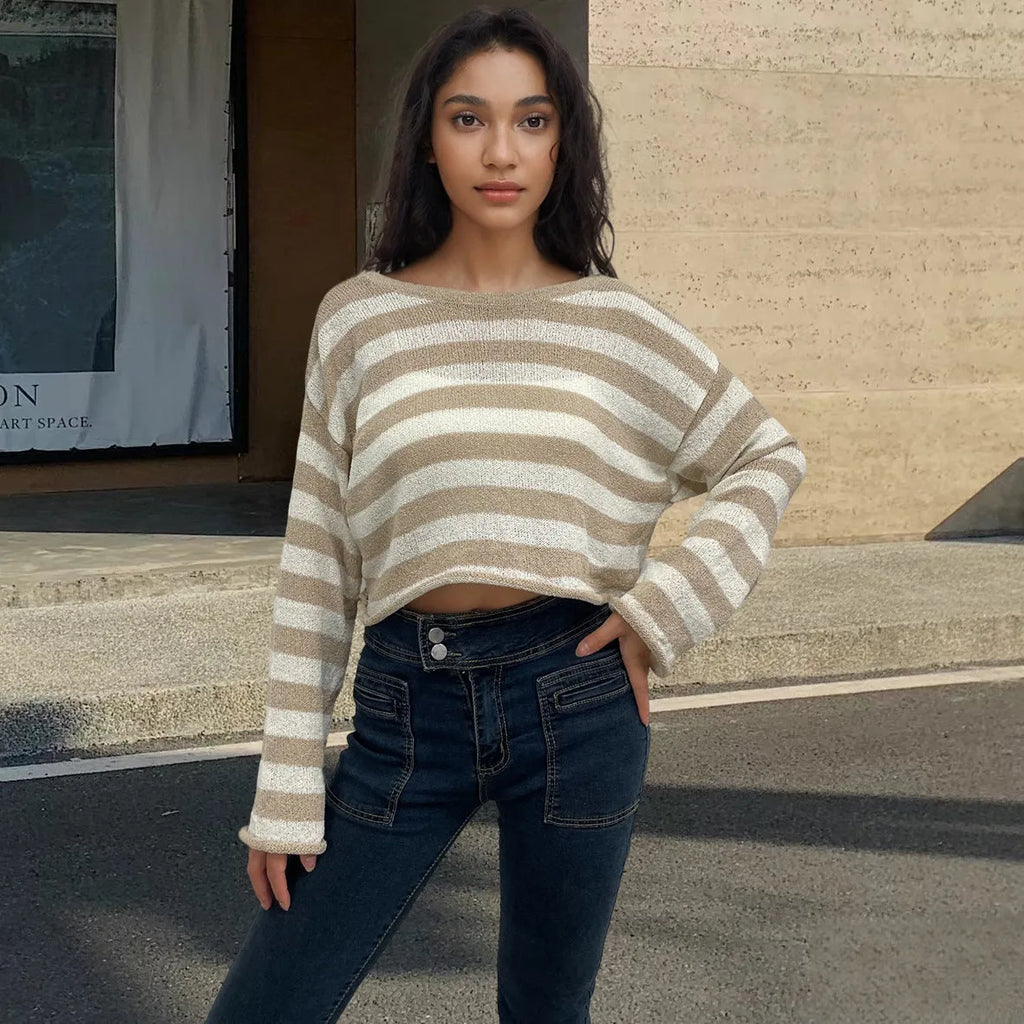 Women's black and white striped long-sleeved sweater with exposed navel front and back design.