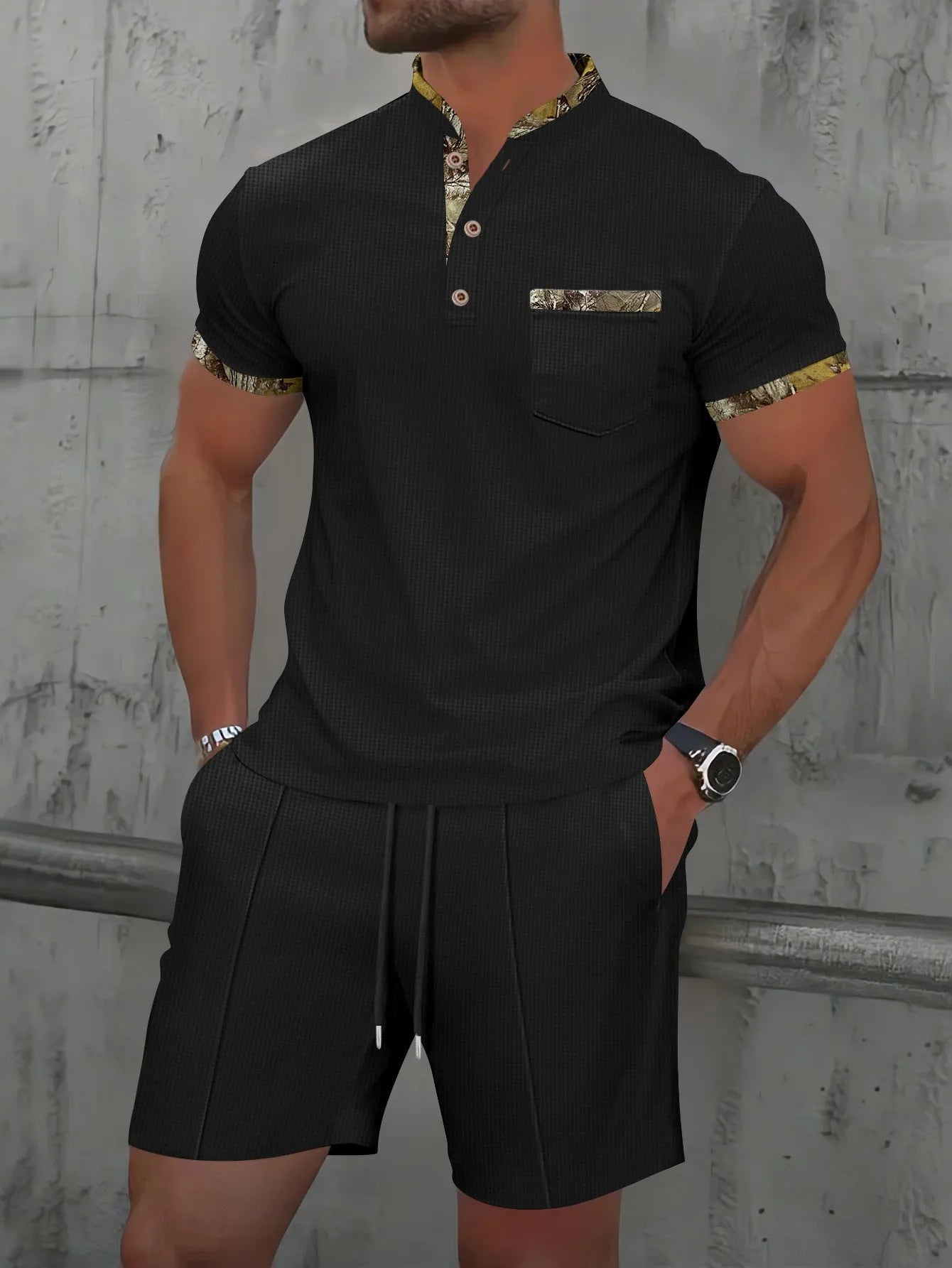Men's grey waffle texture zipper polo short sleeve top with matching shorts laid flat