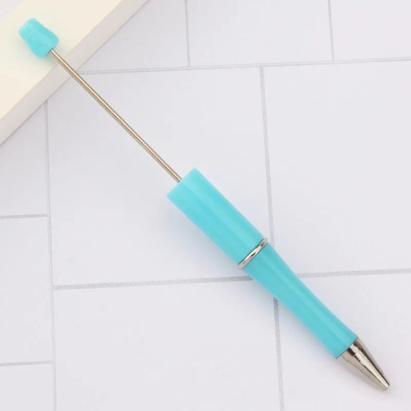 Plastic beaded rotating ballpoint pen in multiple colour options showing gradient and pearlescent finishes