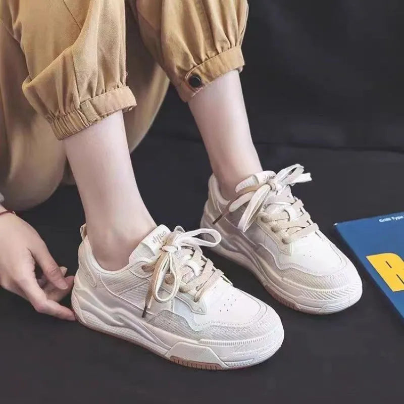Women's pink and white height increasing rubber sneakers with low-top design