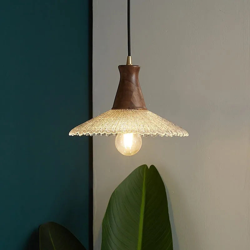 Retro wood and brass chandelier with glass shade in three size options for ceiling mounting.