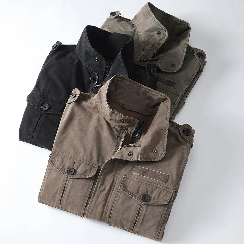 Man wearing a loose-fit light brown cotton twill retro jacket with a zip front.