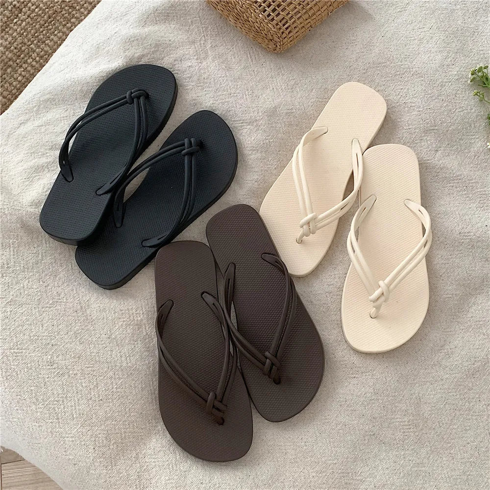 PVC casual flip flops for men with a toe-covering design and textured non-slip soles.