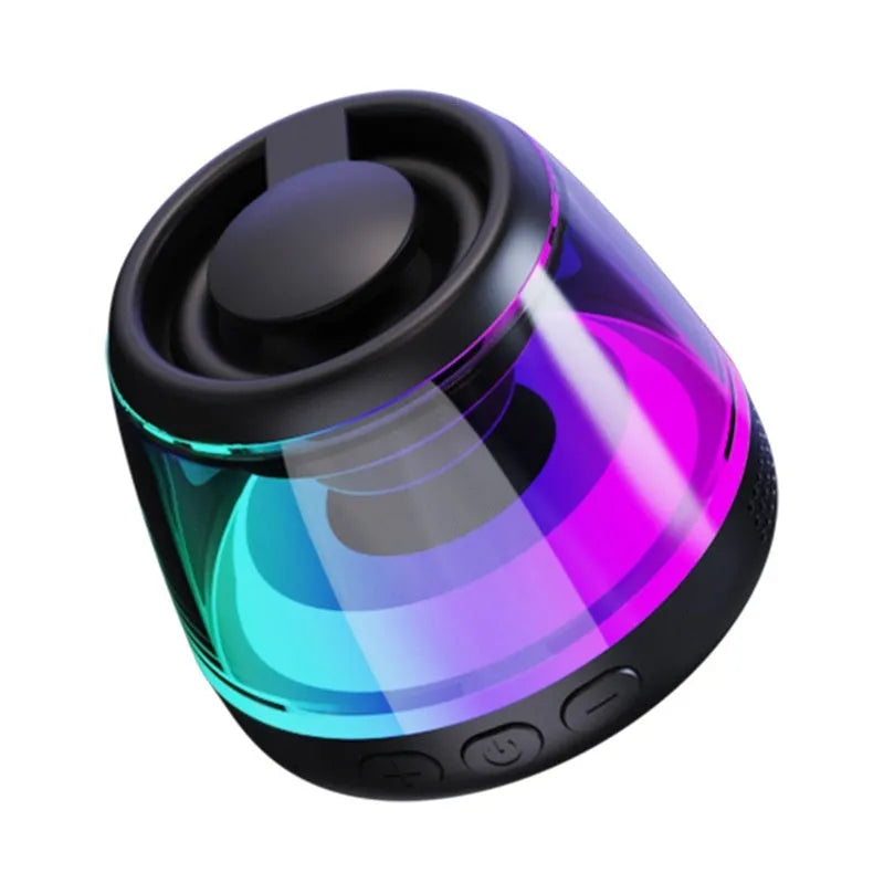 Compact white Bluetooth speaker with LED light on a magnetic base.