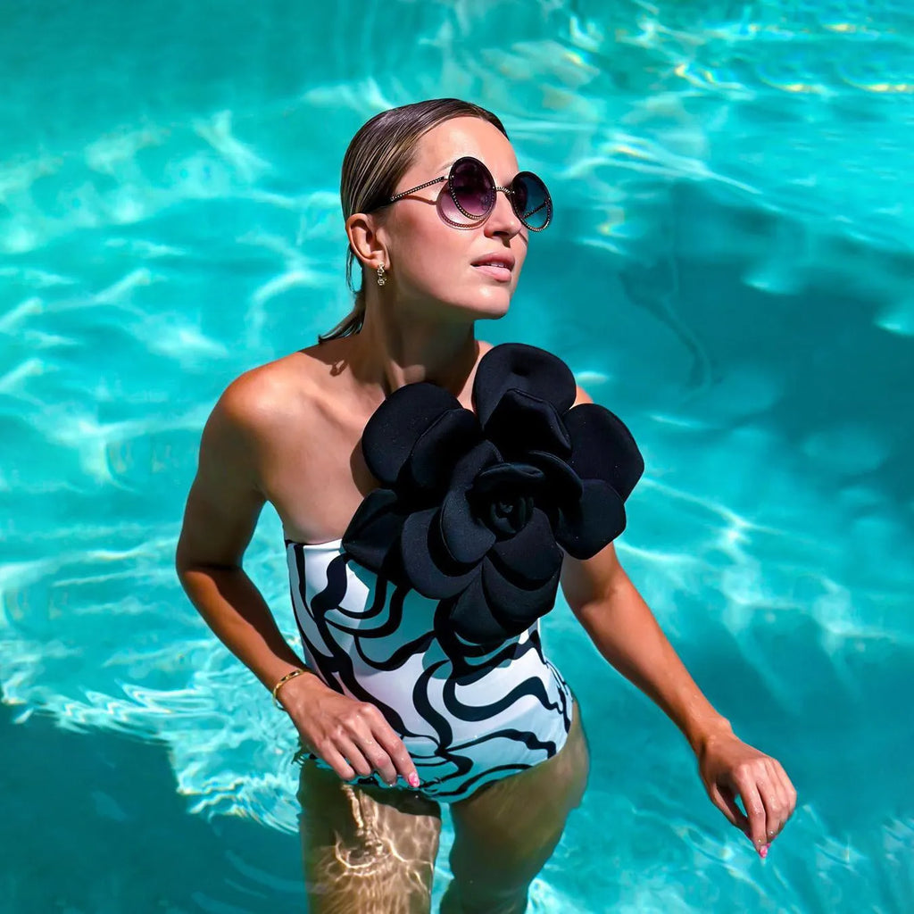 Nylon one-piece swimsuit with floral print, shown in European and American fit.