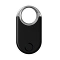 Black and white GPS pet and child tracker device with USB port, showing compact size.