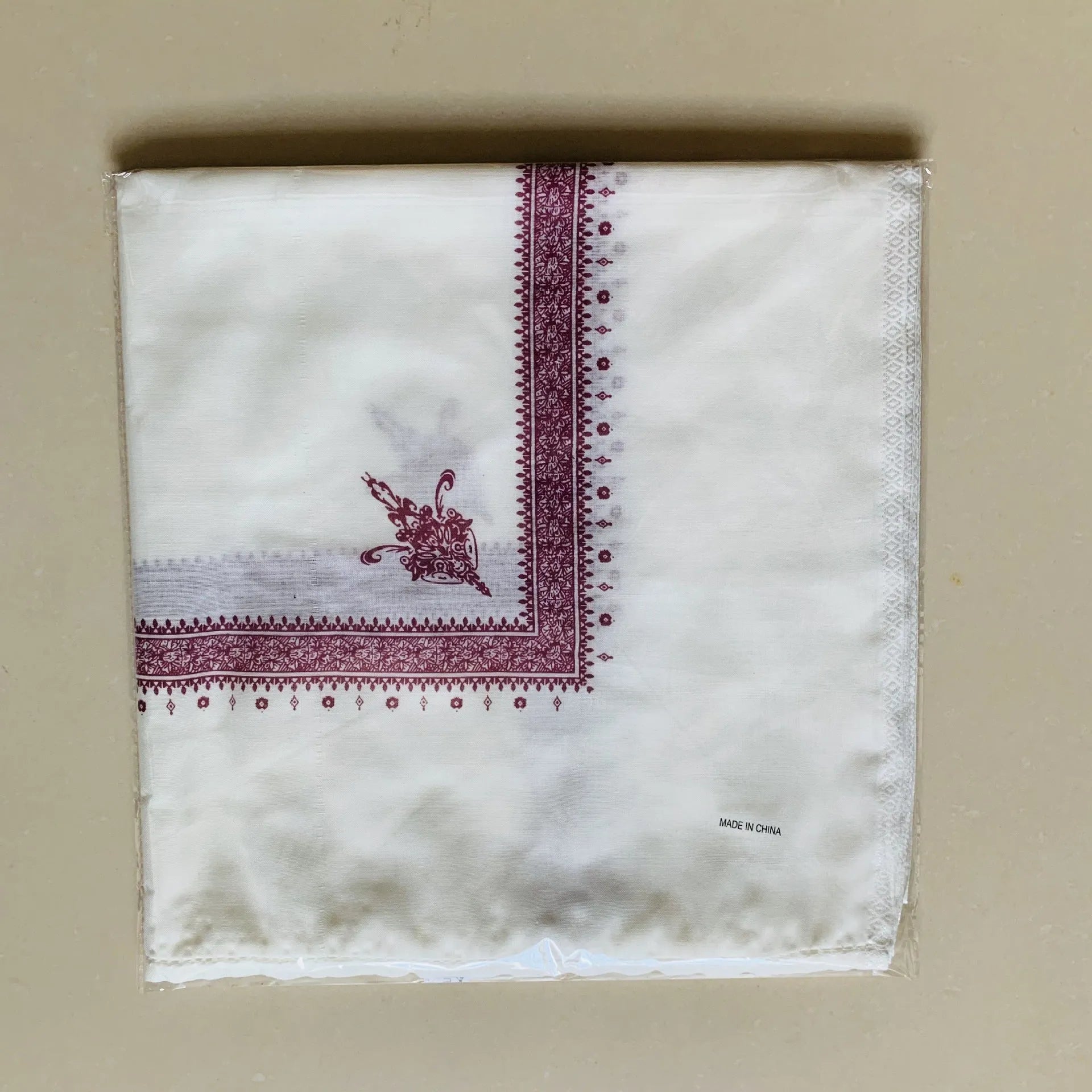 Printed square polyester scarf in a selection of colours, shown flat to display its 138x138 cm dimensions.