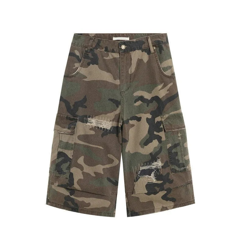 Men's camouflage coloured cropped jeans with ripped detailing and retro patch accents