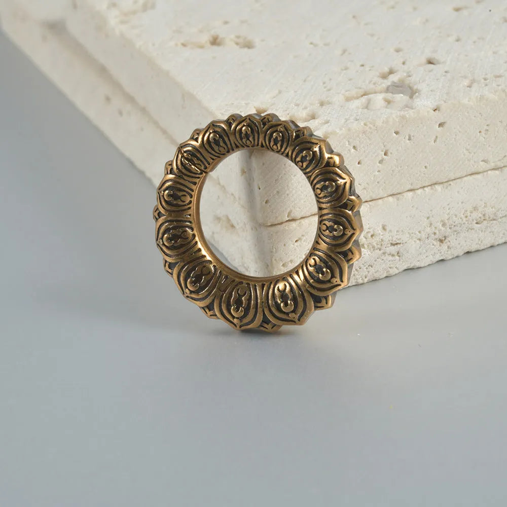 Polished stainless steel retro magnetic earrings featuring hollow heart and lotus geometric shapes in antique silver and gold finishes