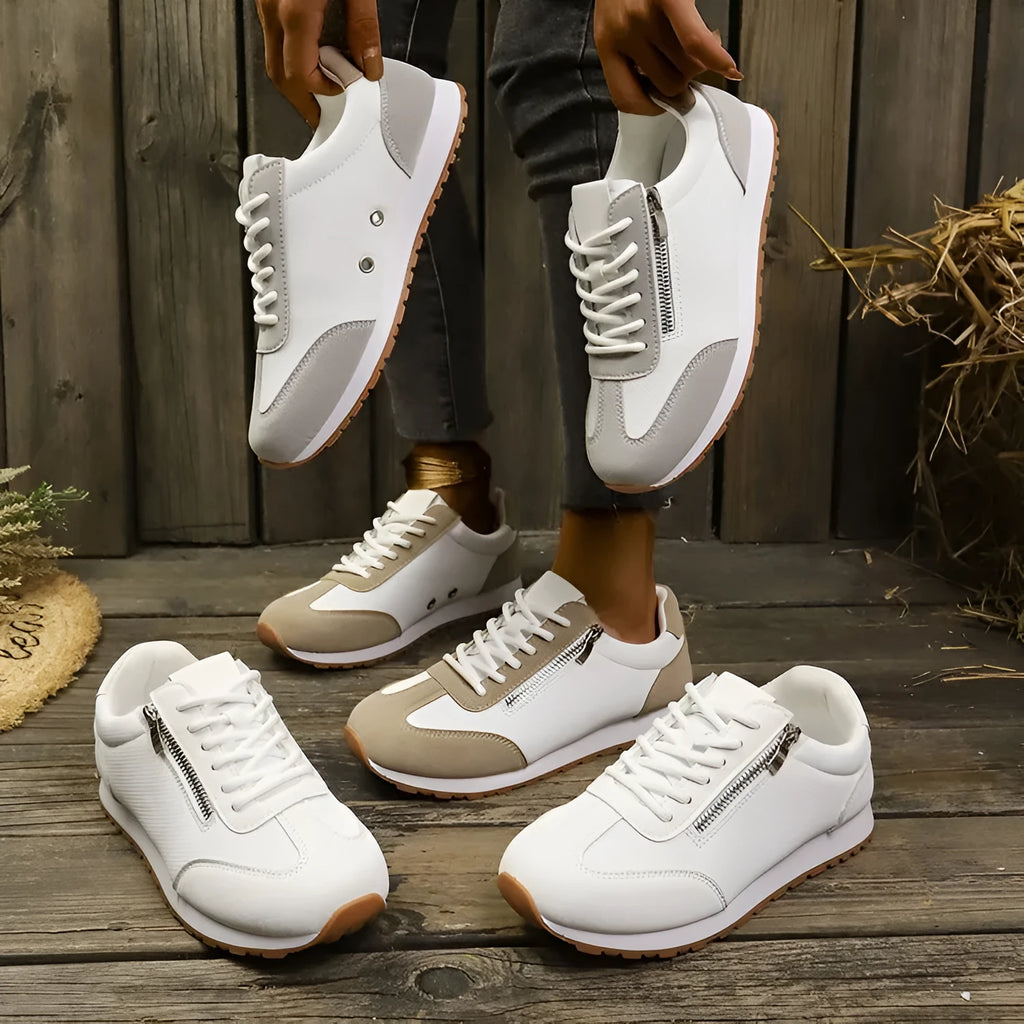 Women's flat-heeled shoes in Champagne, grey, and white with a PU upper and rubber sole.