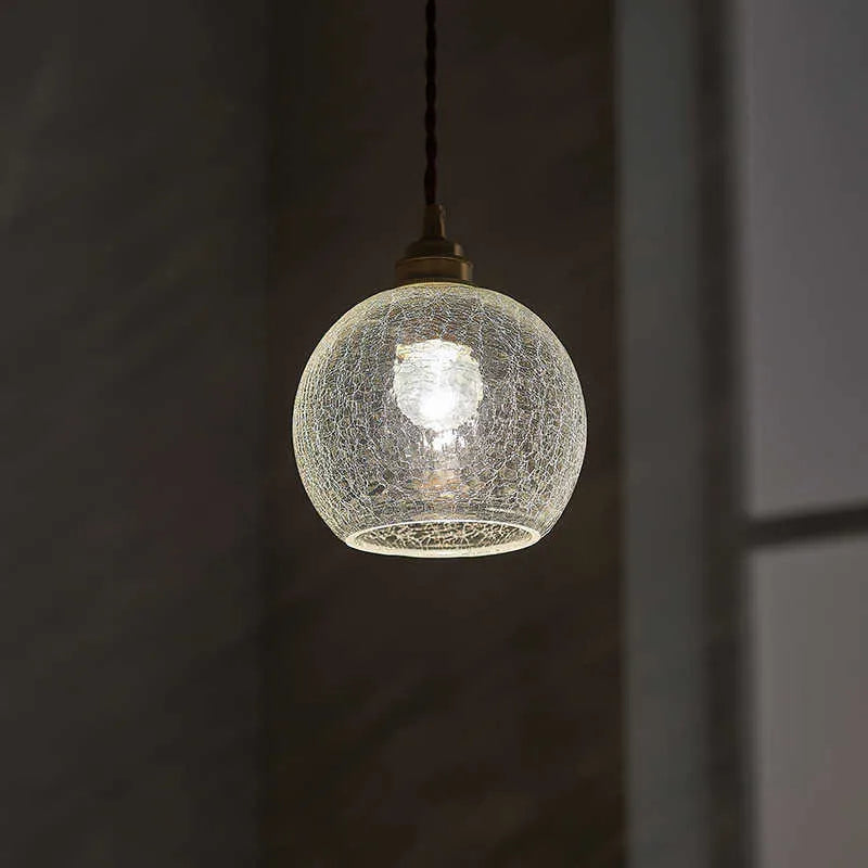 Retro brass chandelier with glass ball shade measuring 17.5 by 15 centimetres