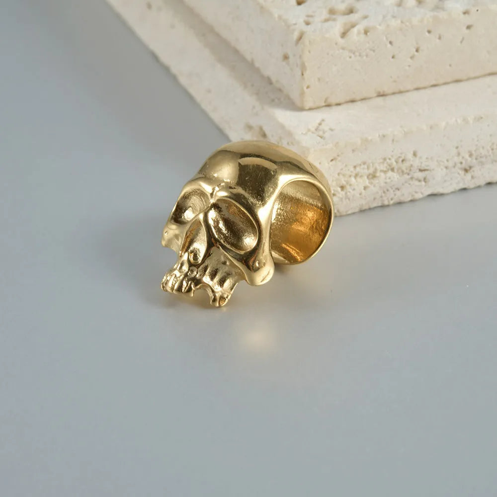 Stainless steel hollow skull Buddha earrings with geometric design in hip hop style