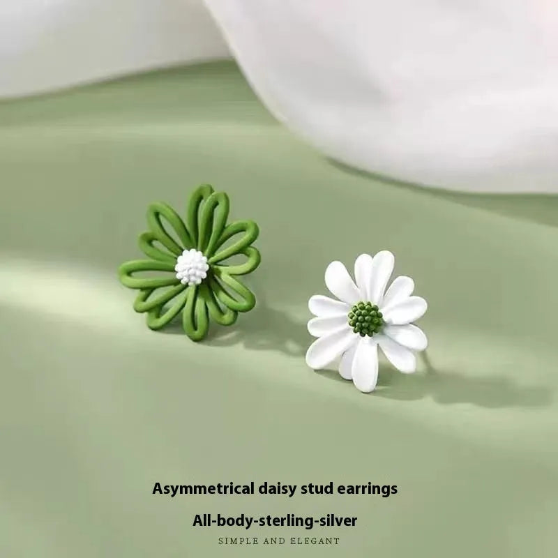 Close-up of colourful alloy flower stud earrings in cartoon style on a white background.
