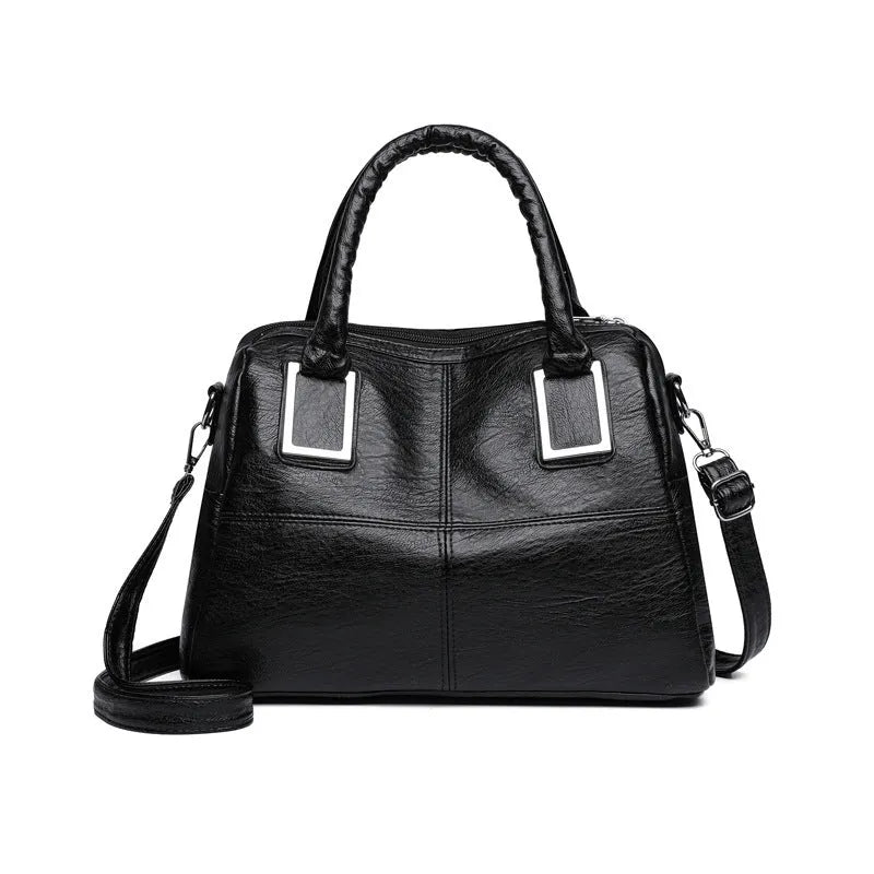 Women's large capacity horizontal square shoulder bag in black, showing internal phone and file compartments.