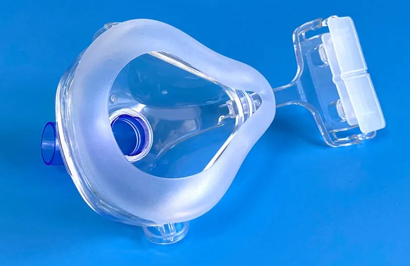 Transparent CPAP breathing mask with silicone construction and adapter elbows for ventilator connection