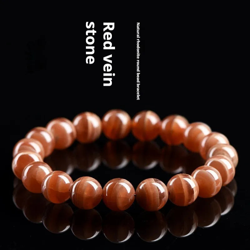 Peruvian Old Mine Rhodochrosite bracelet with geometric design and round beads