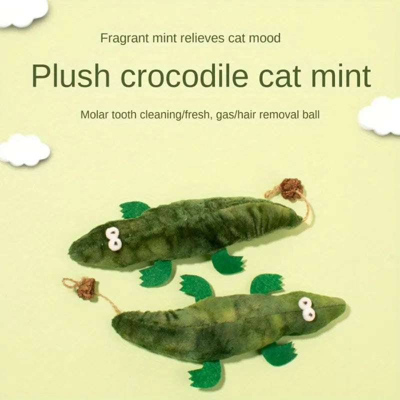 Green plush alligator catnip toy with embroidered eyes and nose