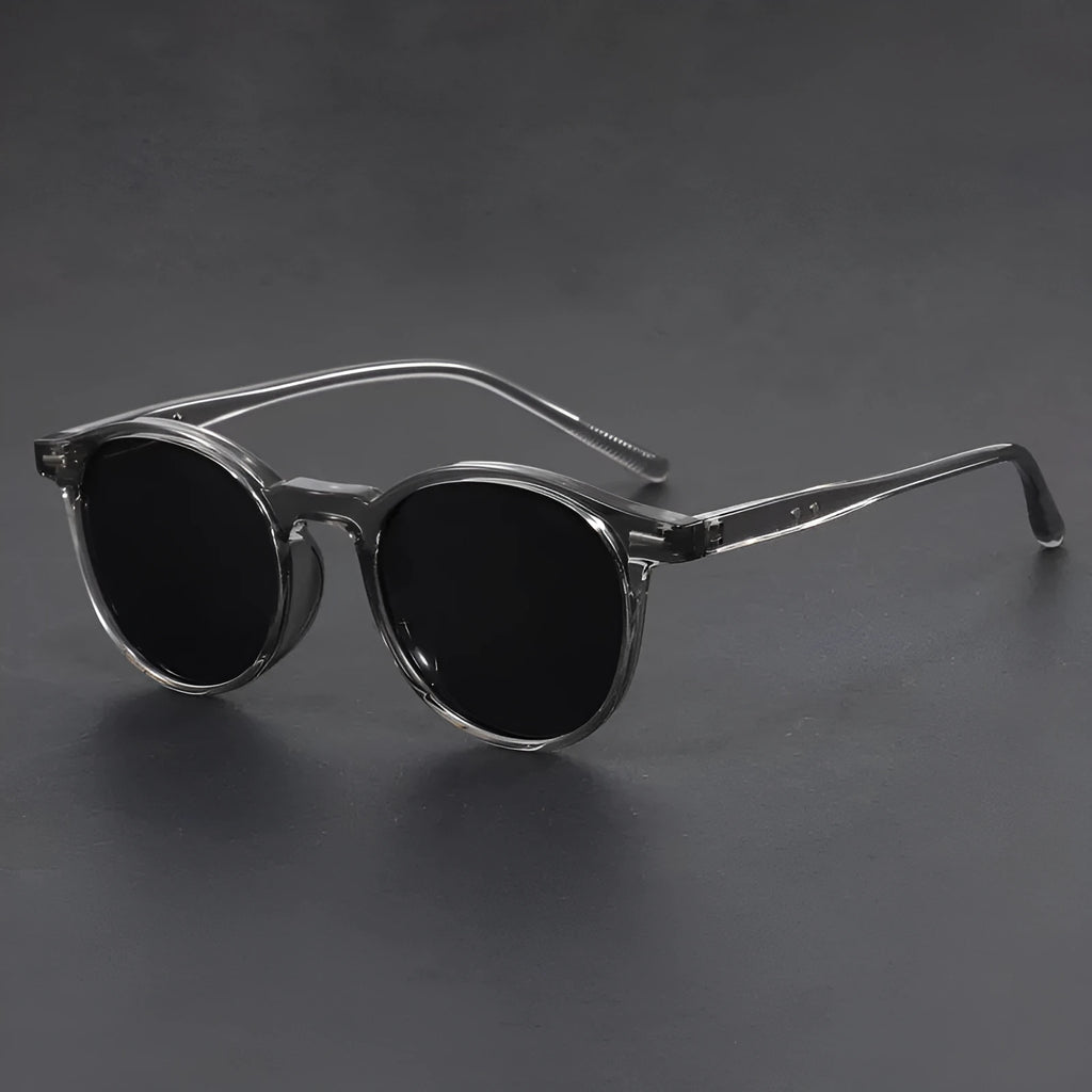 Retro oval frame sunglasses with polarised grey lenses in sand black, bright black, green, grey or dry tea frame colours