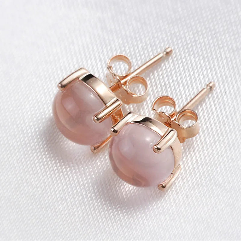 Women's rose gold drop shape stud earrings with synthetic ross quartz detailing and Korean style design