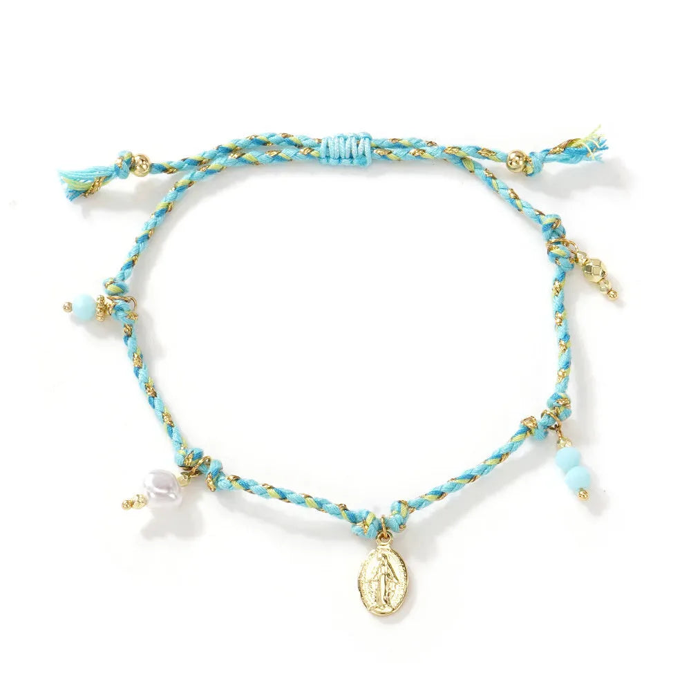 Close-up of a hand-woven colourful braided rope bracelet for women featuring an adjustable carrying strap tag closure.